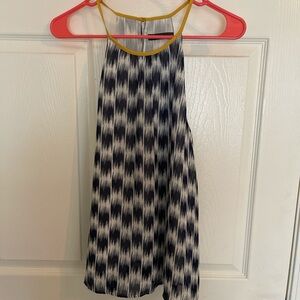 Navy and white, thin but not see through. Yellow neckline.